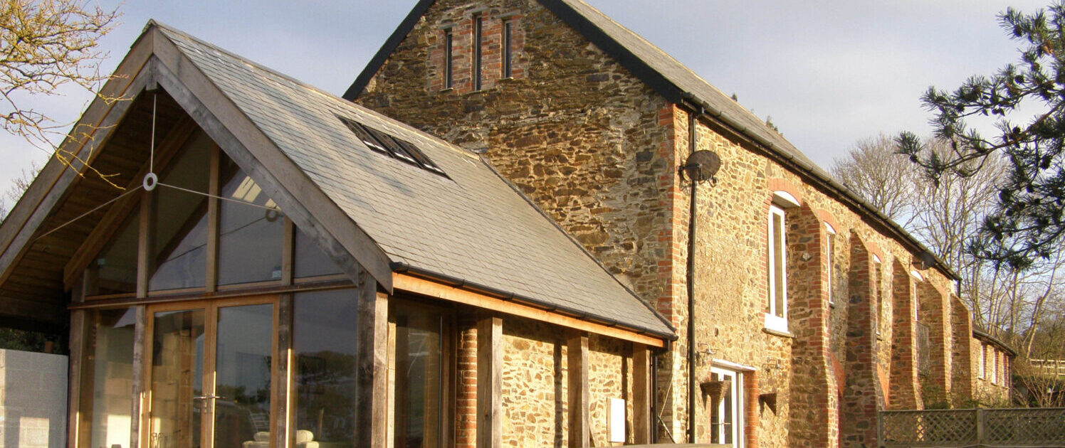 An extension to a Granary building which is within the curtilage of a Grade II* farm near Trusham in Devon