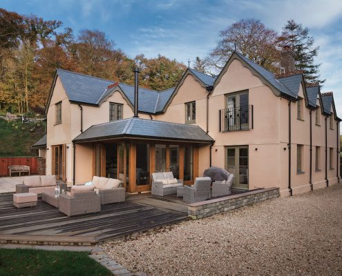 Wooden Extension with a slate grey roof.