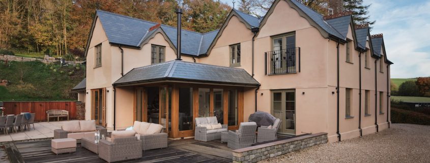Wooden Extension with a slate grey roof.