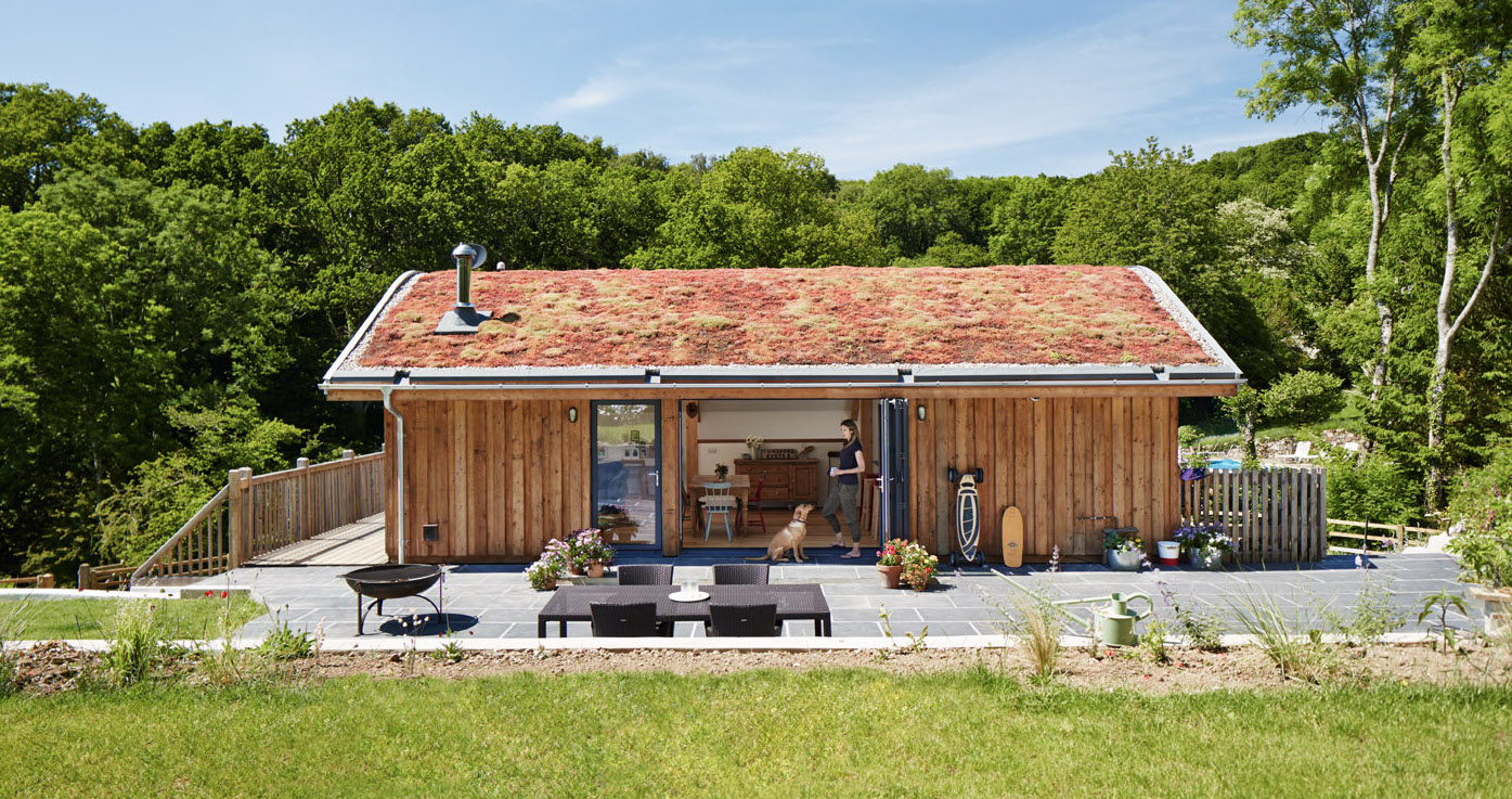 New Sustainable family home with a curved grass roof