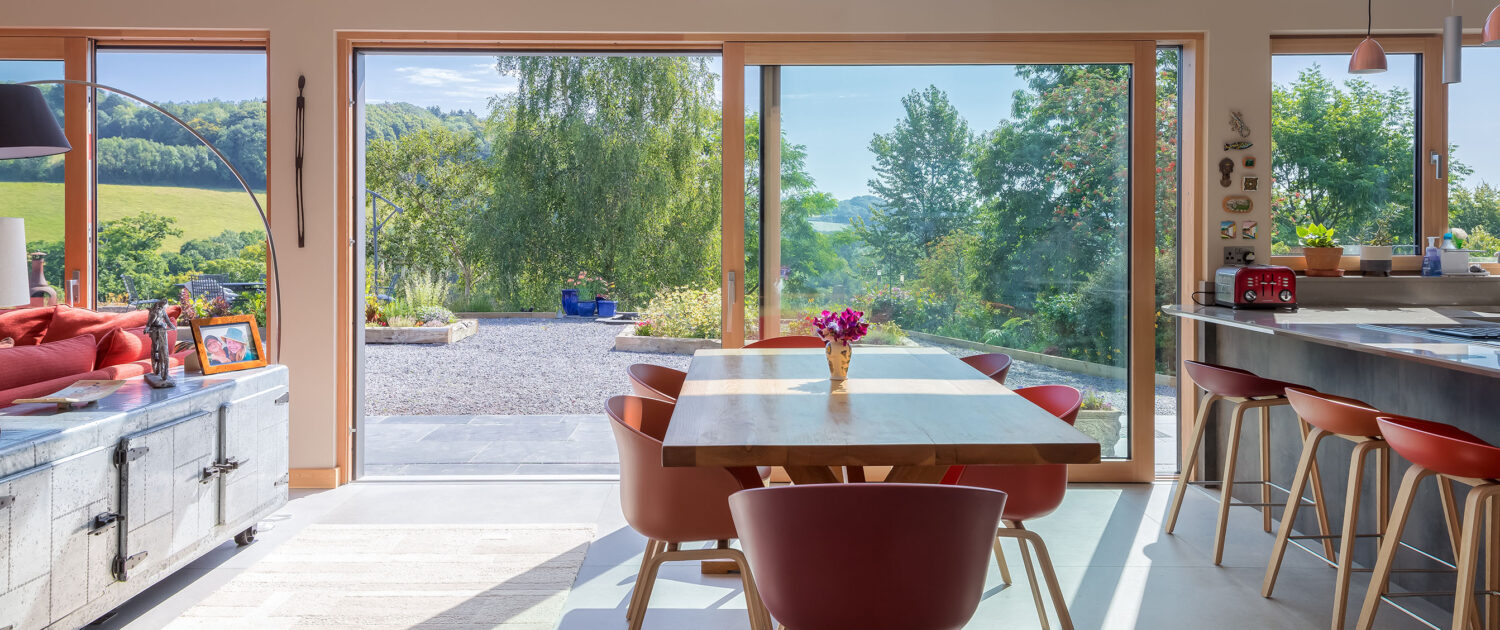 New Build barn Conversion dinning room looking onto hilled view